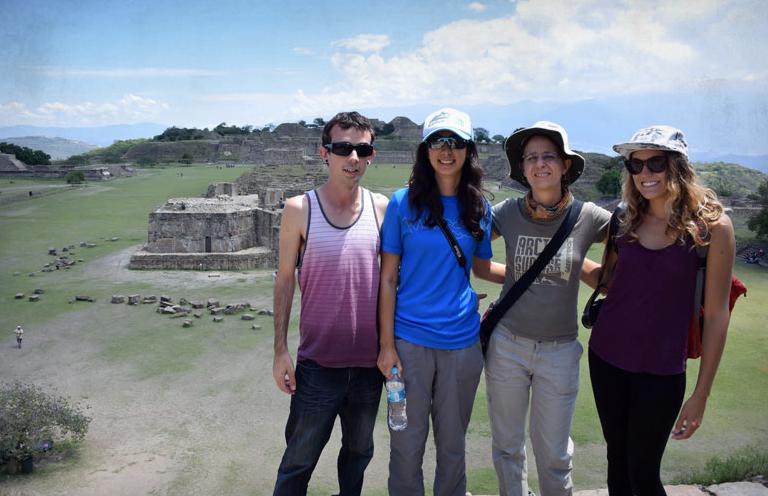 Four members of the Poppy Project visiting ruins in Mexico
